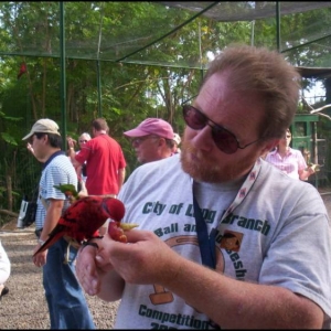 Jim feeds the Parrots at Ardastra Gardens