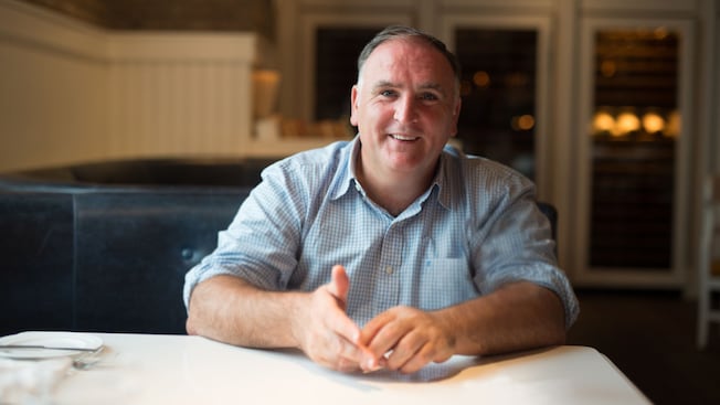 Chef José Andrés seated at a booth in a restaurant