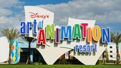 The colorful logo and building exterior of Disney's Art of Animation Resort's Art of Animation Resort
