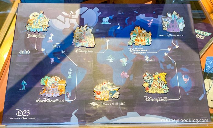 2022-wdw-magic-kingdom-fantasyland-bonjour-villageg-gifts-store-d23-case-disney-parks-pins-700x422.jpg